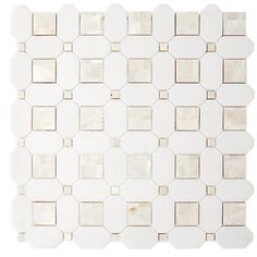 a white mosaic tile pattern on the wall