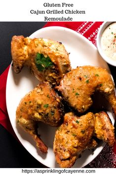 chicken wings on a plate with dipping sauce