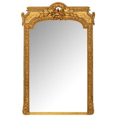 an ornate gold framed mirror on a white background