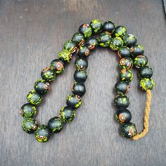 Vintage Trade Floral Green, Black Glass Beads Beaded Necklace vintage African Trade GLASS Beads Beaded Necklace Strand  * BEADS:APPROXIMATELY 36 PCS * Size: 17.5-18mm * Color : Multi Color * Full Strand     INFORMATION                        SHIPPING,PAYMENT,                        RETURN,FEEDBACK 1:We Freely Ship all our items to all over the world via USPS OR Airmail Register Thailand with providing tracking numbers 2:we ship worldwide within 2 business days after receiving cl Black Round Beads Jewelry For Beach, Black Necklaces With Colorful Beads For Beach, Black Beaded Bracelets With Large Beads For Beach, Black Beaded Jewelry For Beach, 8mm Beads, Black 8mm Beads Beach Jewelry, Black Beaded Necklaces For The Beach, Black Beach Jewelry With 8mm Beads, Black Spiritual Necklace For Beach, Black Necklaces With Large Beads For Beach