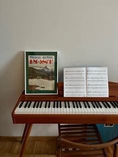 an open book sitting on top of a piano