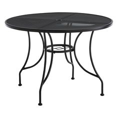 an outdoor table that is black and has a round top with holes on the sides