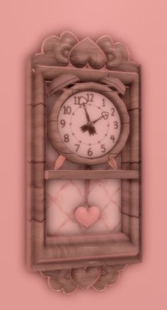 a pink clock with hearts on the sides and an ornate frame in the shape of a heart