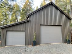 two garages in front of trees and gravel