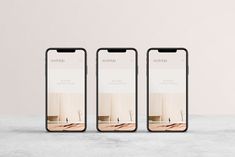 three iphones sitting on top of a table next to each other with the same screen