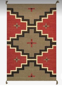 an area rug with red and brown designs on the front, black and white design on the back