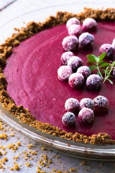 a pie with berries and crumbs on top