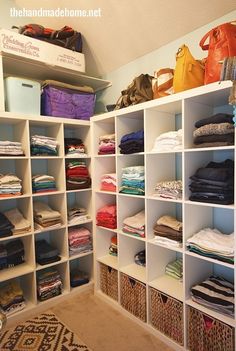 the closet is full of clothes and other things to put on it's shelves