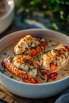 a white bowl filled with shrimp on top of a table