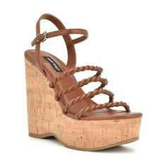 Strappy, chic and fun, the Nine West Renestl is all three. This ultra high platform wedge will be a wardrobe essential with its strappy design, adjustable ankle strap, and cork wedge bottom. Size: Women 9.5.  Color: Brown.  Gender: female.  Age Group: adult. Beige Wedge Sandals, Cork Footbed Sandals, Brown Wedges, Cork Wedges Sandals, Ankle Strap Wedges, Strap Wedge, Strappy Wedges, Strap Pumps, Leather Wedge Sandals