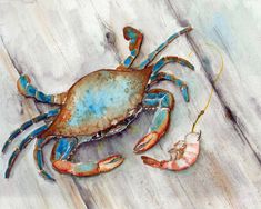 a blue crab sitting on top of a wooden floor