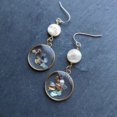 the earrings are decorated with glass and pearls