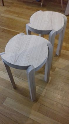 two tables sitting on top of a hard wood floor