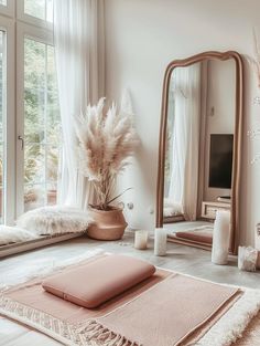 a living room filled with furniture and a large mirror