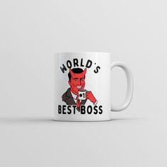 a white coffee mug with the words world's best boss on it and an image of a devil holding a cup