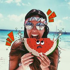 a woman holding up a slice of watermelon with her eyes closed and tongue out