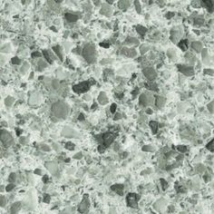 a close up view of the surface of a marble counter top with grey and white colors