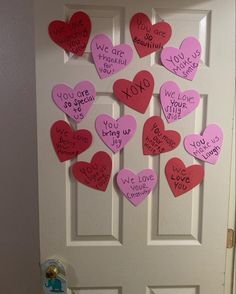 a door decorated with pink and red hearts that say i love you to the bottom