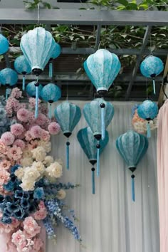 blue and pink lanterns hanging from the ceiling