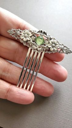 Silver Floral Decorative Hair Comb  This Silver Floral Hair Comb makes a lovely hair accessory for beautiful hair styles. This decorative haircomb has a nice light green crystal center with an array of beautiful flowers. It is great for special occasions like weddings, but can also be great for everyday wear. ☻Color: ~ Silver/Green ☻Link to More Hair Accessories: https://www.etsy.com/shop/FashionCrashJewelry?ref=profile_header&search_query=hair+accessories ☻Link to The ENTIRE SHOP: https://www.e Daphne Bridgerton Hair Accessories, Prom Accessories Hair Styling Tools, Wedding Accessories Hair Styling Tools, Fancy Hair Clip, Green Hair Accessories, Rhinestone Hairpiece, Hair Accessories Green, Hair Accessories Silver, Hairpiece Wedding