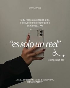 a woman holding an iphone in her right hand with the caption'es solo un reel '