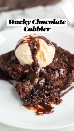 a piece of brownie with ice cream on top is sitting on a white plate