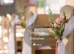 flowers are tied to the back of a wooden chair at a wedding ceremony in germany