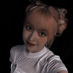 a doll with red hair wearing a white t - shirt