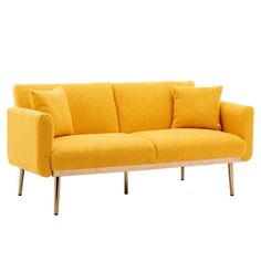 a yellow couch sitting on top of a wooden frame