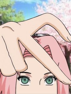 a woman with pink hair and blue eyes holding her hand over her head