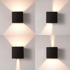 three black square lights on a white wall