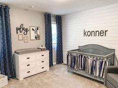 a baby's room is decorated in blue and white