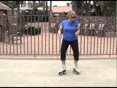 a woman riding roller skates down a sidewalk