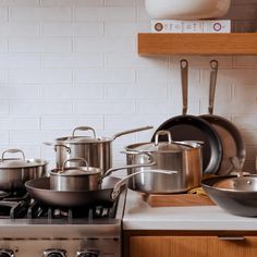 pots and pans are sitting on the stove top