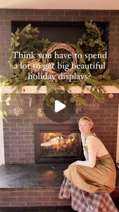 a woman sitting in front of a fire place