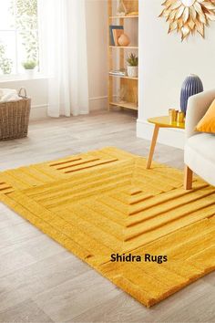 a living room with yellow rugs and white furniture in the background, there is a large sunburst hanging on the wall