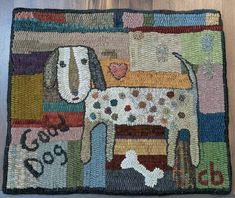 a patchwork rug with a dog on it's front and back ends are made out of multicolored fabric