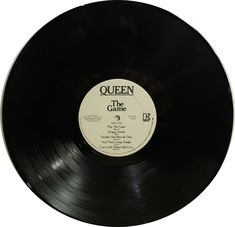 an old black record with the word queen on it