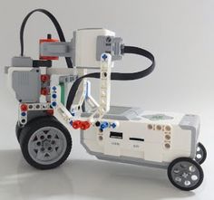 an image of a robot that is made out of legos and parts on wheels