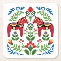 a red horse with flowers and leaves on it's back coasters are set against a white background