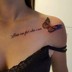 a woman with a butterfly tattoo on her shoulder that says, love me for what i am