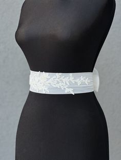 Wedding belt with train |Tulle Bow Bridal Sash | Ivory Bow Belt | Wedding Dress Sash| Over-sized Bow  Rhinestone Belt | Crystal Dress Sashes A stunning, elegant statement wedding sash is exquisitely beaded in beautiful vintage pattern. Your choice tulle  sash is attached to the beading and ties at the back into a bow.  An ultimate luxurious accent piece for your wedding dress or for any special occasion dresses. Accentuate your waist and add a touch of feminine charm to any dress with this tulle sash. Even the most simple gown can transform into a dreamy ensemble with this voluminous bow. Color embroidery - ivory Color tulle on photo - ivory The belt is made as a long ribbon that you can tie around your waist. Elegant White Bride Sashes, Elegant Bridal Sashes For Bride, Elegant Bridal Sashes, White Wedding Dress With Sashes, Elegant Ribbon Bridal Belt For Wedding, Fitted Lace Bridal Belt For Bride, Lace Bridal Belt With Sashes For Wedding, White Fitted Bridal Belt For Ceremony, White Bridal Belt For Bride