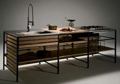 a kitchen with an island made out of wood and metal