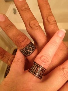 two people with rings on their fingers