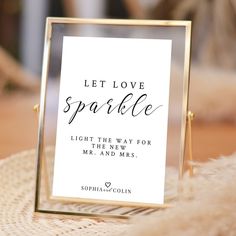 a sign that says let love sparkle light the way for mr and mrs