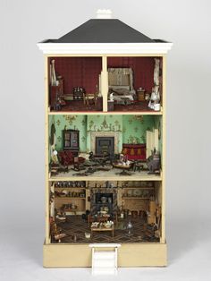 a doll house with furniture and accessories in it's display case on a white background