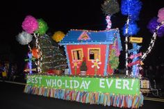 a parade float decorated with lights and decorations