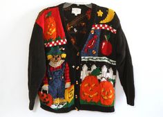 an ugly sweater is hanging on the wall with pumpkins and jack - o'- lanterns