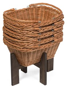 a wicker basket sitting on top of a wooden stand