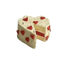 there is a piece of cake with hearts on it